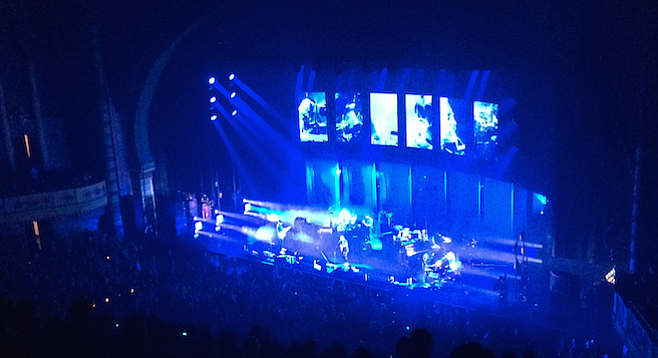 Radiohead emerged from the silent darkness and began the night with ”Burn the Witch,” the abrupt first single off their latest album, Moon Shaped Pool.
