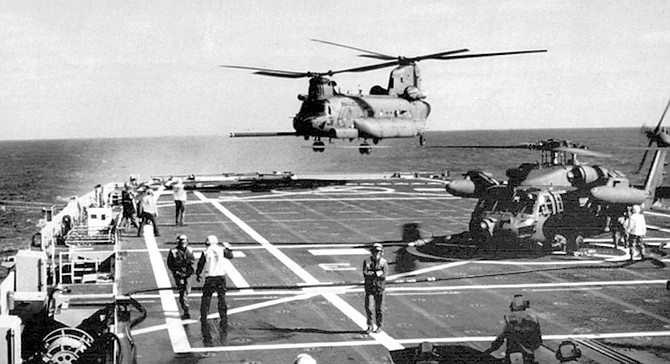 MH-47 (Chinook) landing.  If SEALs properly planned their operation, aircraft could be strafing, rocketing, and bombing within minutes of enemy contact.