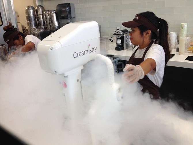 A cloud of nitrogen steam bursts forth from the equipment at Creamistry.