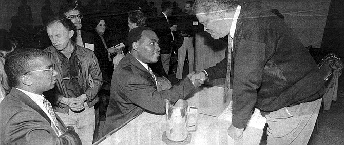 Ishmael Reed (right) greets convention-goers