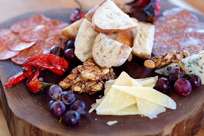 House-made charcuterie with seasonal, local meat, cheese, fruits, and vegetables