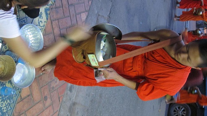 Monk receiving alms