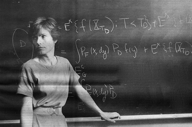 Photo: A teacher in front of her chalkboard | San Diego Reader