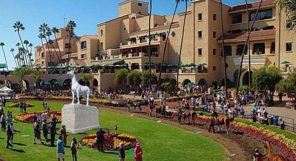 Horse racing enthusiasts gather around the newly installed monument dedicated to “all the swift and selfless equines who gave their lives on this manicured ground for our entertainment and remuneration” at the Del Mar racetrack. The Del Mar Thoroughbred Club has announced that the names of all future Del Mar horse fatalities will be engraved on the monument’s base at the conclusion of each season. When asked why the monument would not include the names of past fatalities, Bigwig shook his head and replied that in order to do that, he’d need a monument the size of the Vietnam Wall.