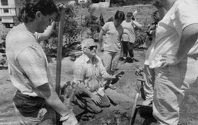 John McMillin (in sunglasses) explains planting techniques to his students at Rancho Sordo Mudo, 1993