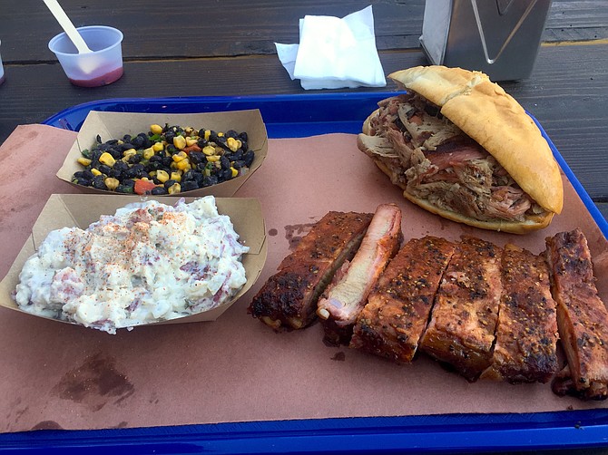Pulled pork sandwich, some sides, and ribs
