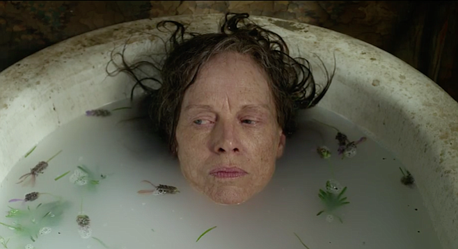 Judy Davis as Madcap Molly taking a long overdue bath in The Dressmaker.