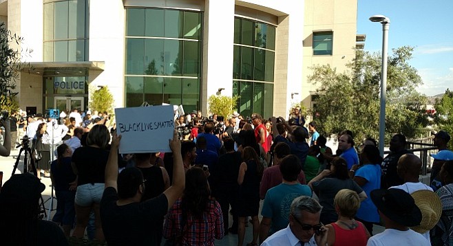 Protesters rally outside El Cajon Police Department on the morning of September 28