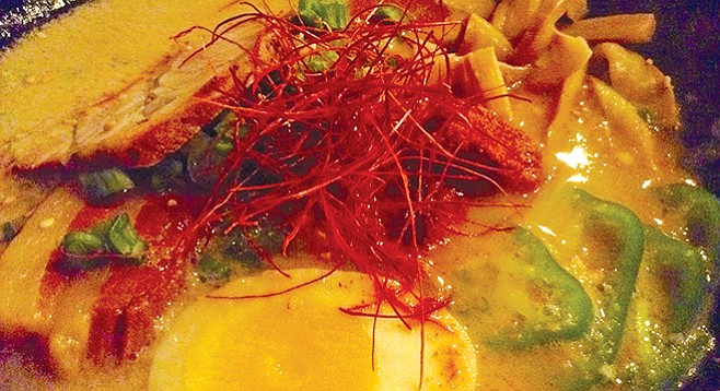 My Kakuni Ramen dish. Notice red bell pepper shavings and the slab of pork belly.