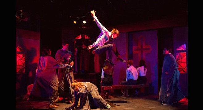 Michael Mizerany (center) flying right side up in Bare: A Pop Opera at Diversionary Theatre