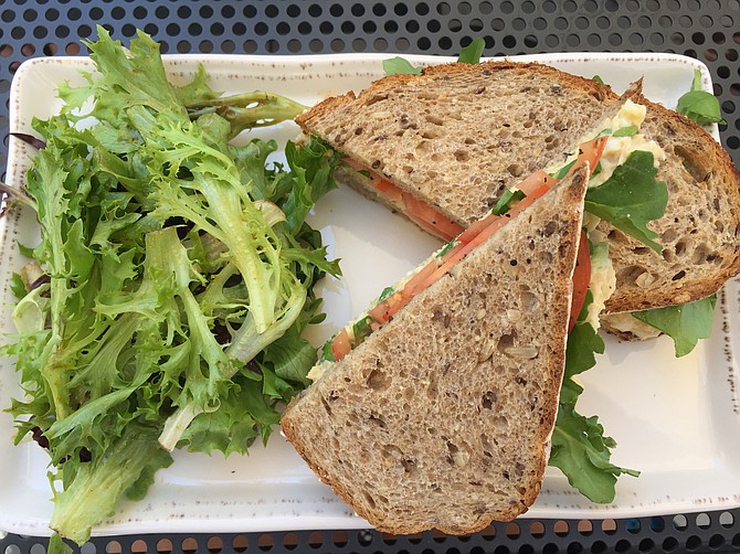 The Albacore-Egg salad has lettuce and tomato and is served on multigrain bread.