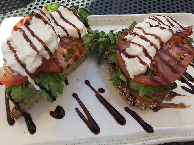The Milanese-style avocado toast has arugula, burrata cheese and tomatoes with some drizzled balsamic syrup. 