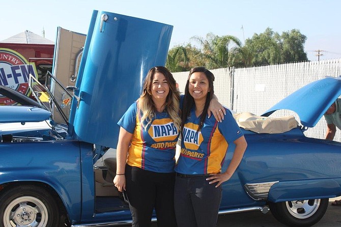 NAPA AUTO PARTS officials enjoying the classic cars provided by East County Cruisers during the Grand Reopening at 1235 Broadway, El Cajon, earlier this month.

Pictured (l. to r.) NAPA El Cajon IBS District/Area Manager Shawna Staggs and NAPA El Cajon Store Manager Jenna Wong. 
