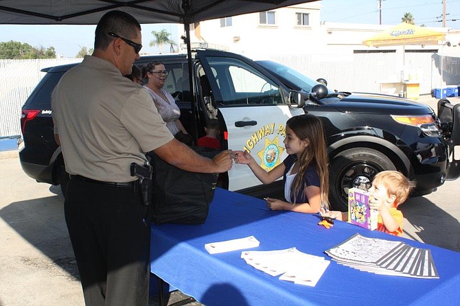 Guests taking part in complimentary safety programs hosted by California Highway Patrol during the NAPA AUTO PARTS Grand Reopening at 1235 Broadway, El Cajon this past weekend.