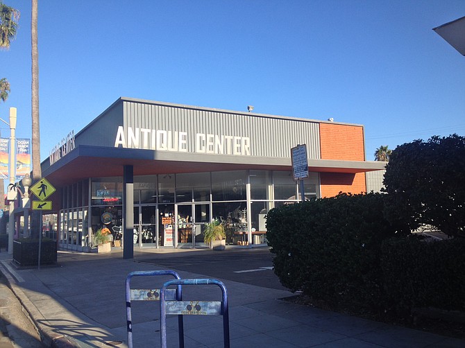 The Antique Center is on the market for lease or sale, parking not exactly included.
