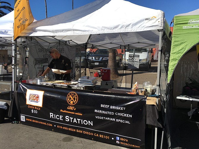 Ibo the chef at work in his farmers’ market rice station