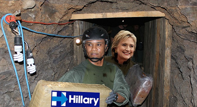 Hillary Clinton smilingly carries a bag of “imported Colombian coffee” through one of the Juarez Cartel’s many tunnels between the United States and Mexico as a sign of friendly trade relations to come. “I was really touched by her willingness to actually get down under the ground and walk with us,” says tunnel rat Ernesto Cabrillo, pictured. “I’m not a citizen of the United States, and also a convicted felon, but she's definitely getting my vote."