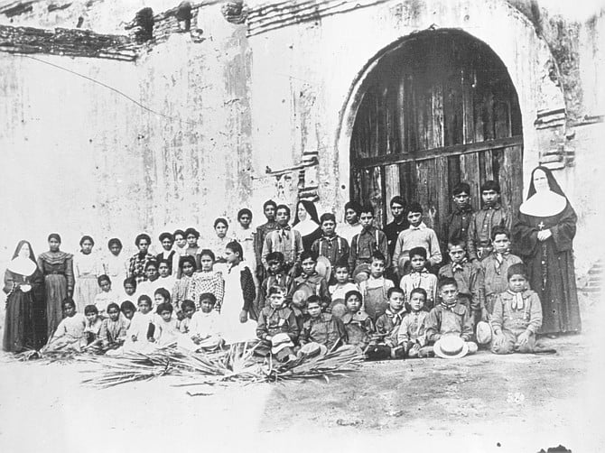 Indian children with nun at San Diego Mission