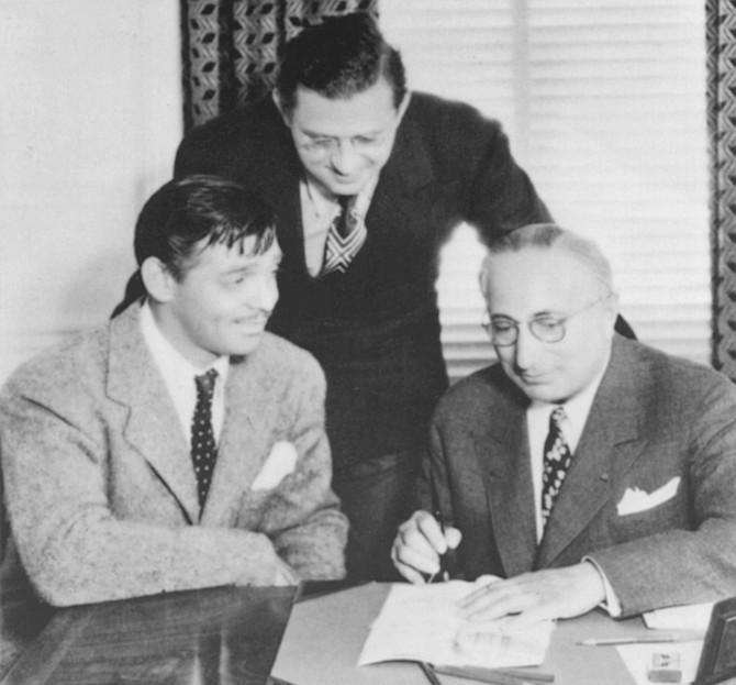 Clark Gable, David O. Selznick, and Louis B. Mayer signing the Gone with the Wind contract