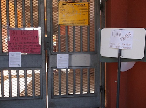 "Gate broken" sign at Garfield Elementary suggests using "far side gate"