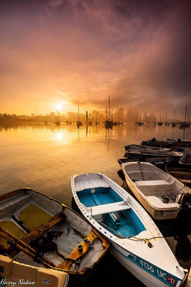 Taken in the morning of November 6, 2016, just after DST ended.  Fog was on and off around downtown San Diego at this time, which made a dreamy scene.  This is a view from a small pier on North Harbor Drive.