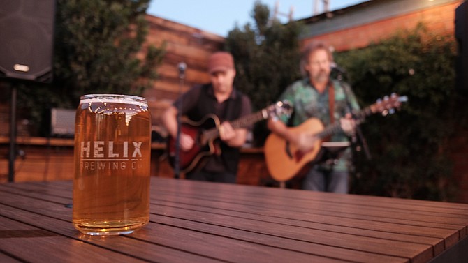 The Setting Sons duo plays a show in the beer garden at helix Brewing Co. in La Mesa.