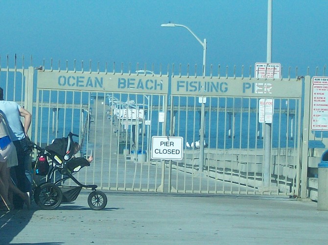 OB Pier closed due to big waves and high surf.