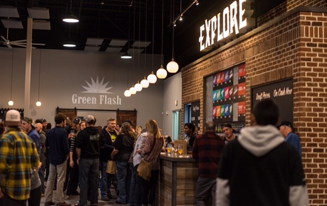 Visitors gather for the East Coast rendition of Green Flash's annual Treasure Chest fundraiser, on the opening day of its Virginia Beach brewery and tasting room.