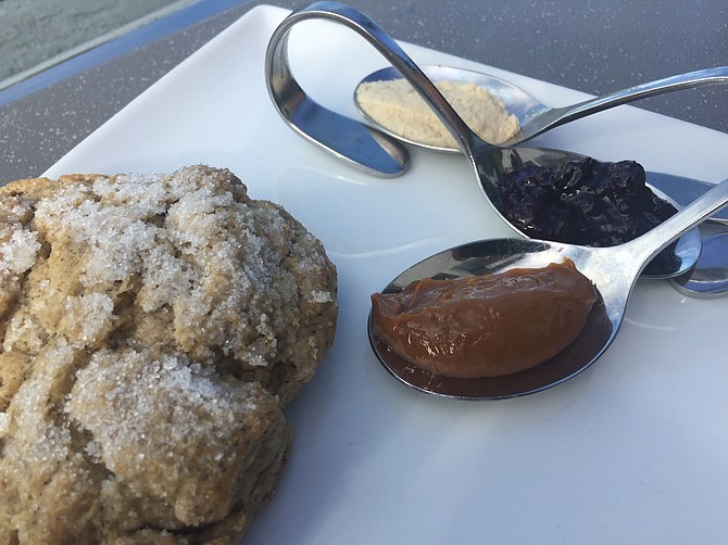 The coffee scone comes with three choices of spreads: a berry jelly, honey butter, and dulce de leech.