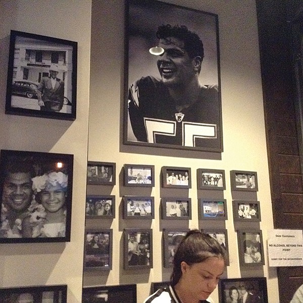 On the wall: memories of family and owner’s close friend, Junior Seau.