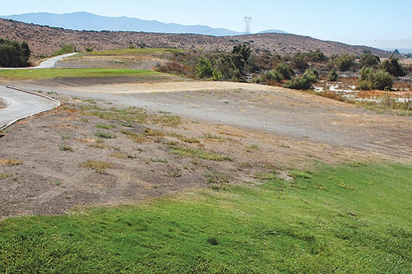 With a dried up lakebed to the right this hole features two forced carries.
