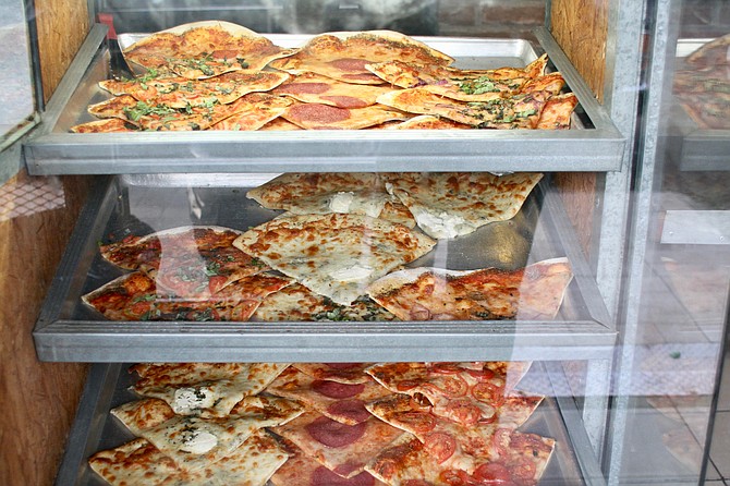 Glass case pizza display on an early Wednesday at Al Volo