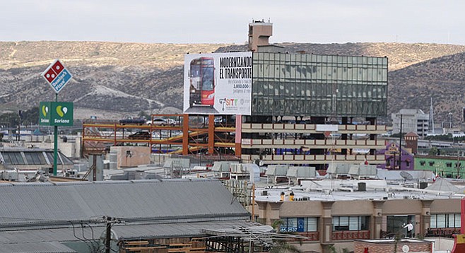 Downtown Tijuana billboard announcing the upcoming buses - Image by Matthew Suárez