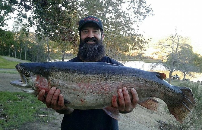 Steve Capps sets new record — a 16.41-pound trout — at Lake Dixon.