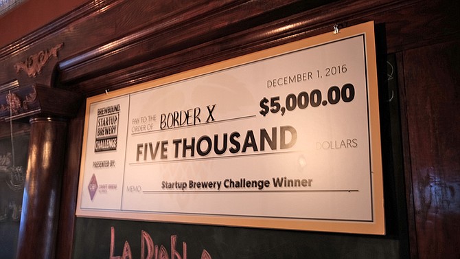 The giant check confirming Border X won five grand