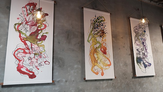 The artwork at Newtopia Cyder represents its flagship cider flavors.