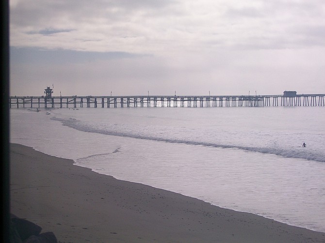 San Clemente Pier in Orange County from Amtrak train heading north.