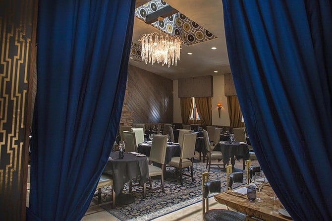 The dining room, decorated as a French restaurant should be (including chandeliers).