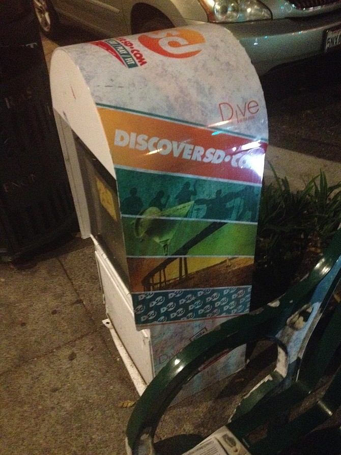 An SD Discover news rack remains empty in Encinitas