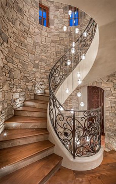 Stairs and noted glass chandelier