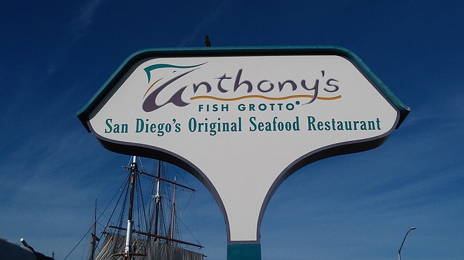 People have lined up for 70 years to dine at Anthony’s Fish Grotto on the harbor.
