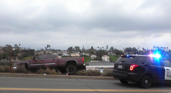 One bystander said he was afraid that the truck would roll down the hill and end up on Interstate 8.