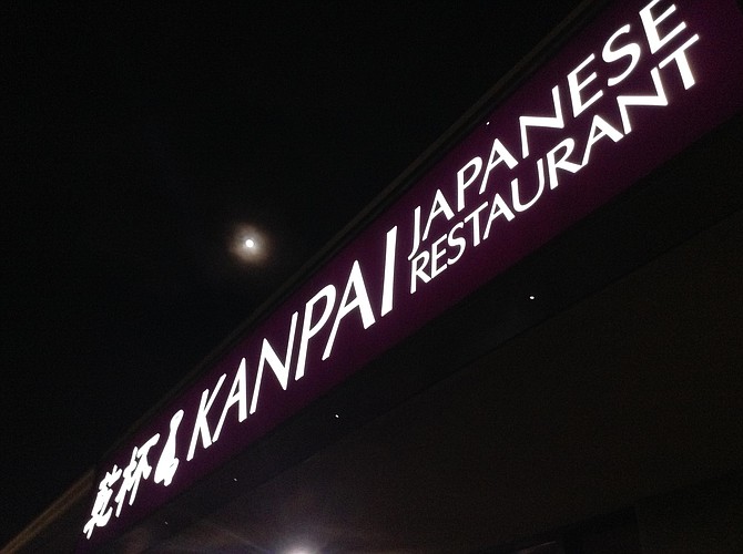 Kanpai's sign, under the moon