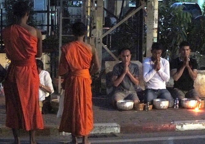 faithful waiting for the monks