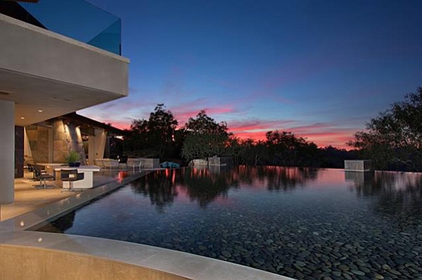 “The pool and water features were designed with seamless integration between the home and landscape.”