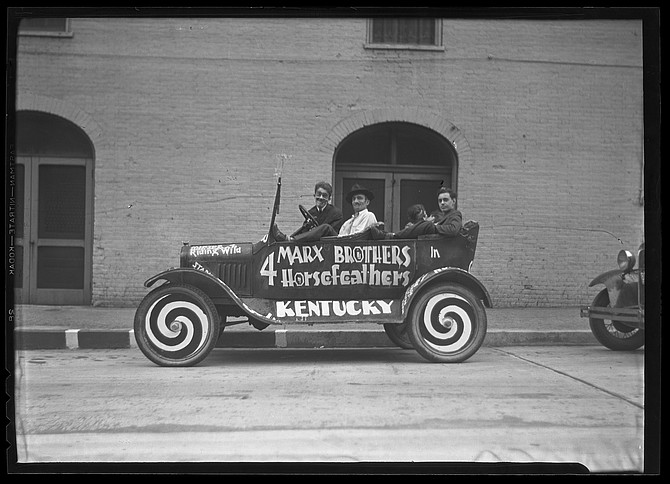 Promotional lookalikes were hired to cruise the streets of Lexington in a Formula 1 Marxmobile. 