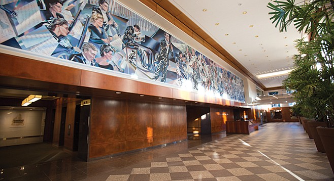 The mural in the lobby of downtown’s Symphony Towers hints at the hidden Copley Symphony Hall hidden within.