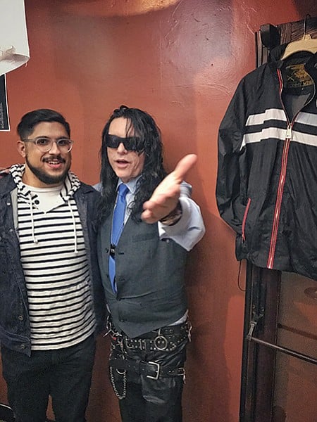 International man of mystery Tommy Wiseau poses with a fan.