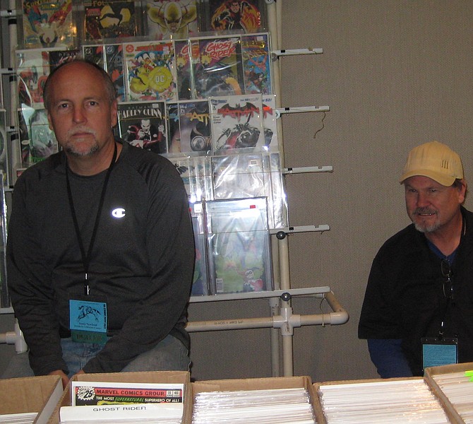 Southern California Comics booth with owner Jamie Newbold seated on the right. 