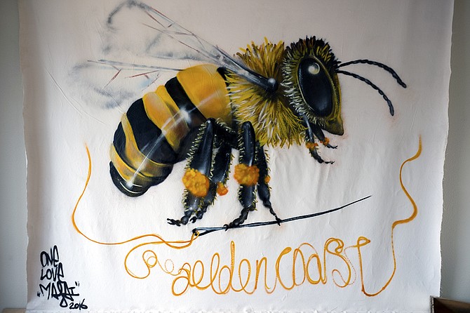 A mural in the new Golden Coast tasting room celebrates bees making honey for mead.